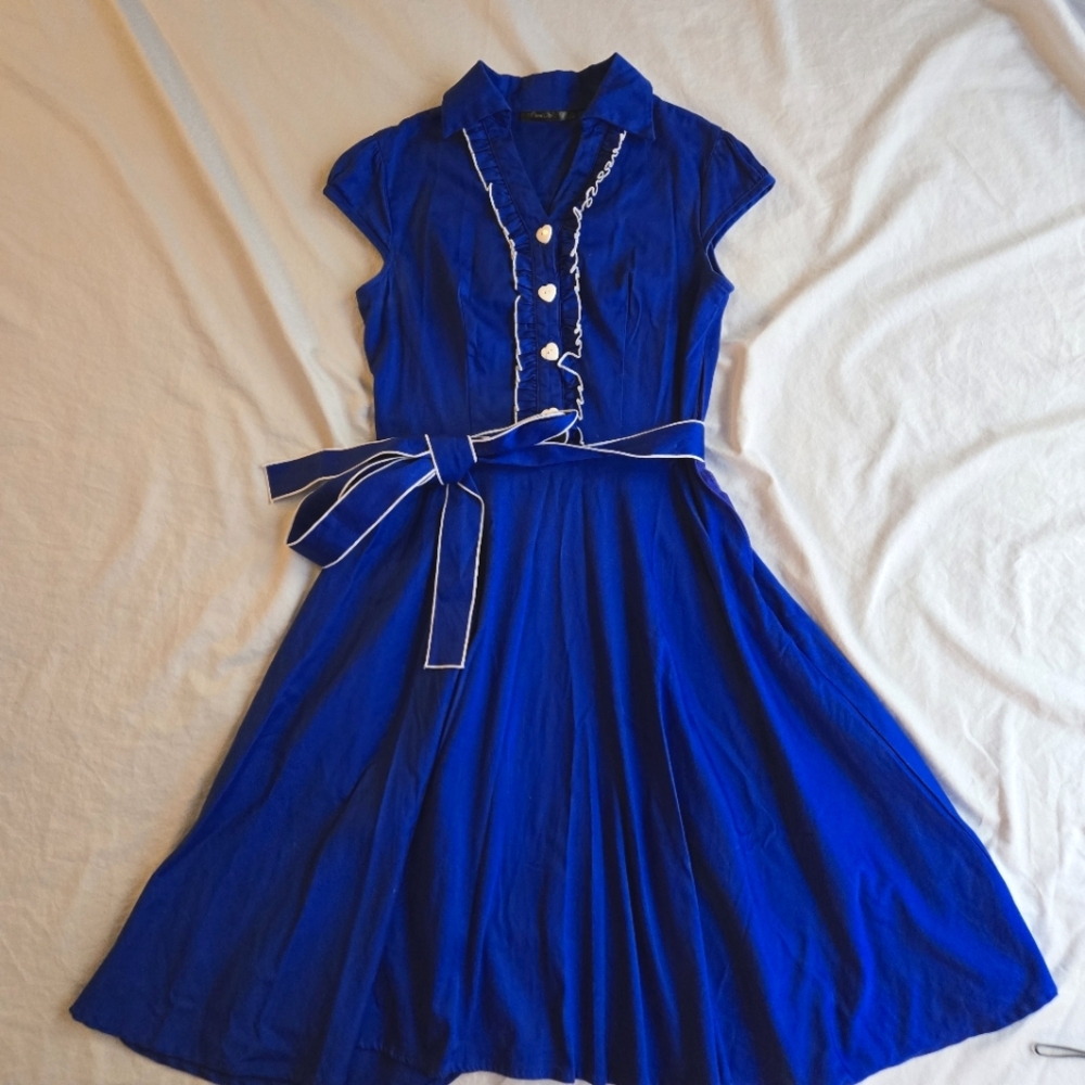 Anni Coco Retro Vintage Style bright blue ruffle trim heart button front